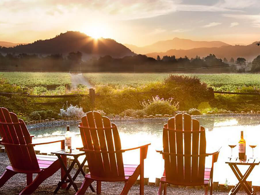 Adirondak chairs at sunset